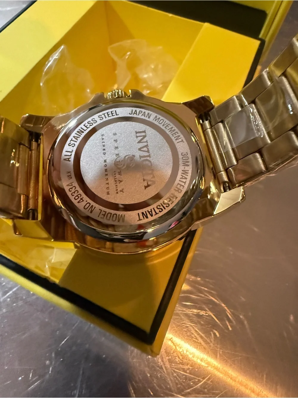 Invicta Gold Tone Watch with Blue-Green Dial